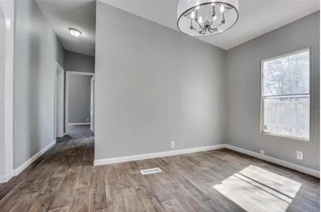 a view of an empty room with a window