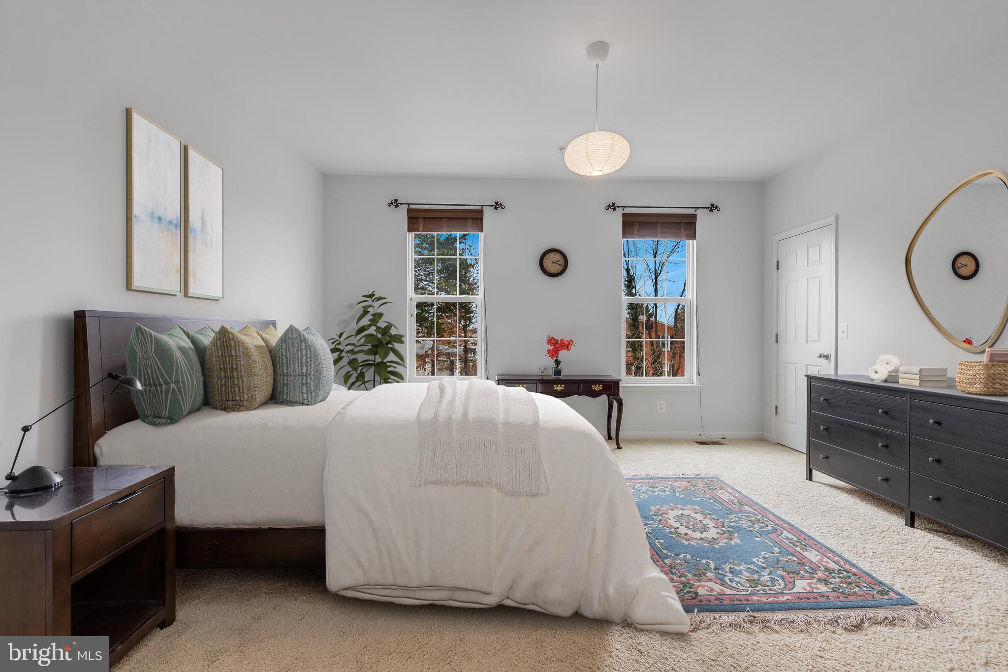 9409 Stonewall Road Manassas, VA 20110 - Photo 11 of 26 a bedroom with a bed and a dresser