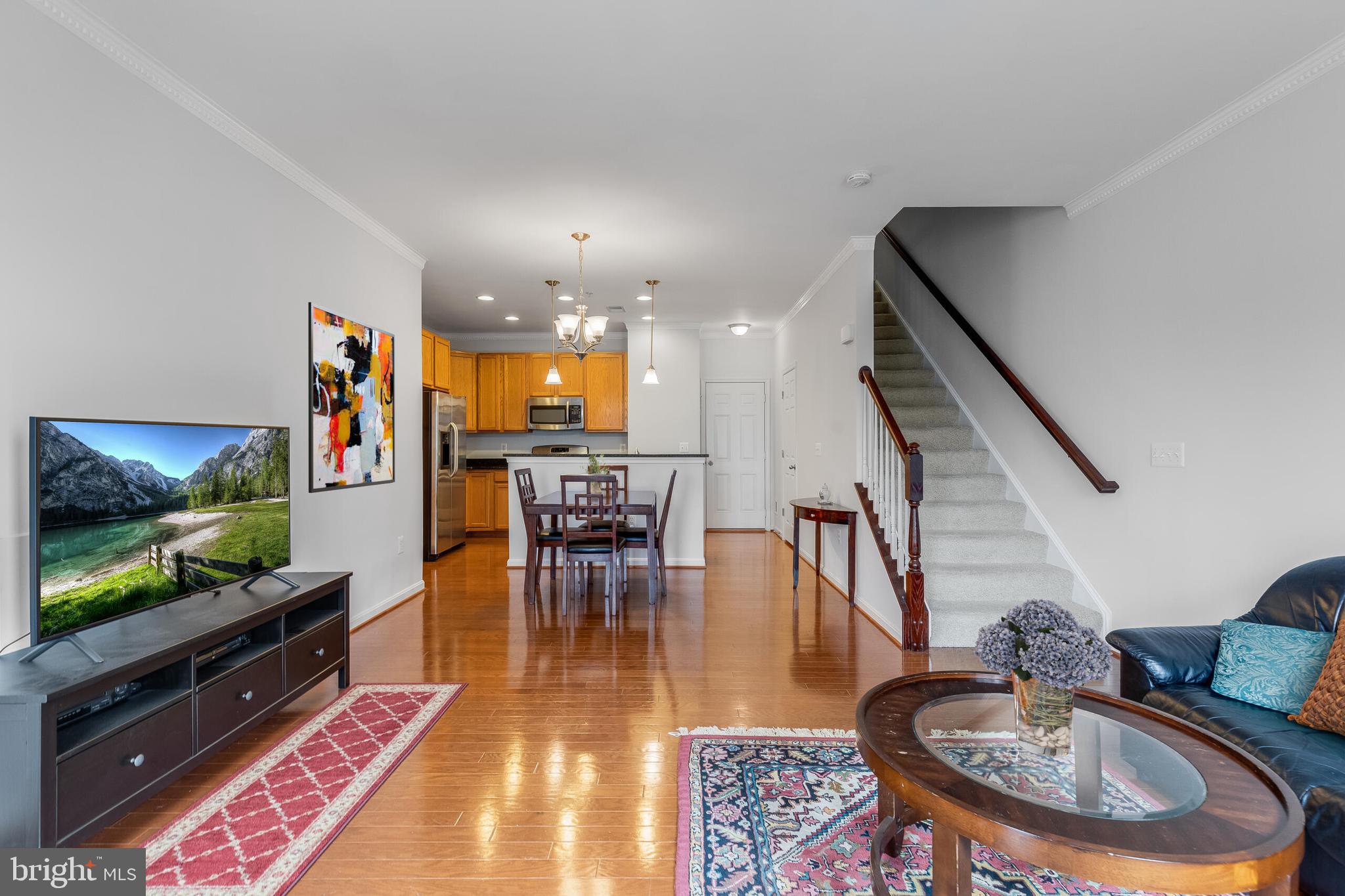 9409 Stonewall Road Manassas, VA 20110 - Photo 3 of 26 a living room with furniture and a flat screen tv