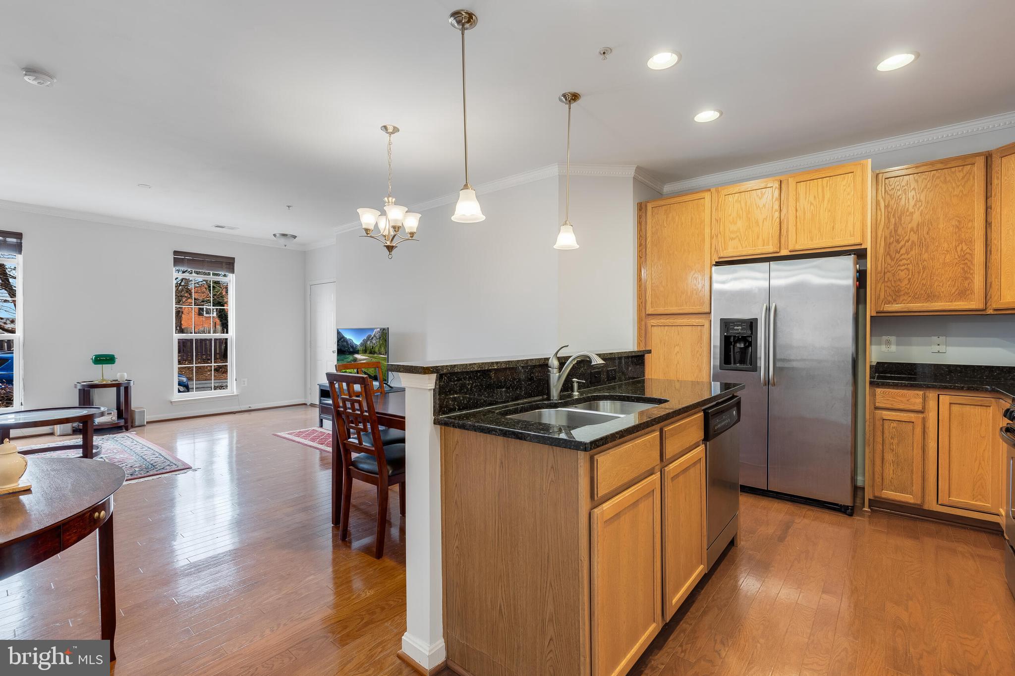9409 Stonewall Road Manassas, VA 20110 - Photo 9 of 26 a kitchen with stainless steel appliances granite countertop a stove and refrigerator
