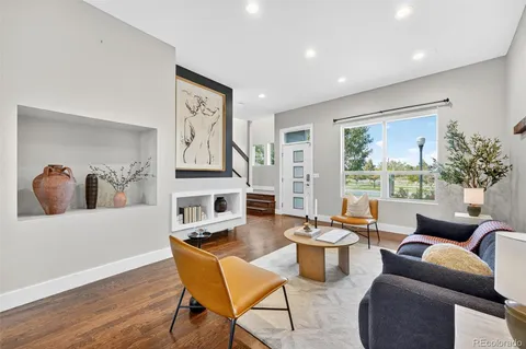 a kitchen with stainless steel appliances granite countertop a sink and a large window