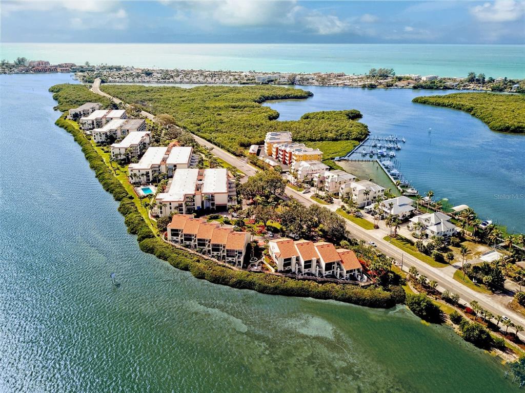 Aerial View of Sandpiper Key Condominiums. The are all of the buildings on the left side of the road.
