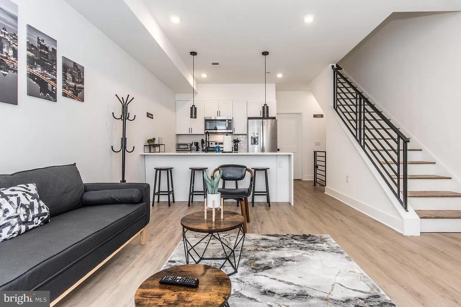2435 Master Street, Unit 2 Philadelphia, PA 19121 - Photo 2 of 9 a living room with furniture and wooden floor