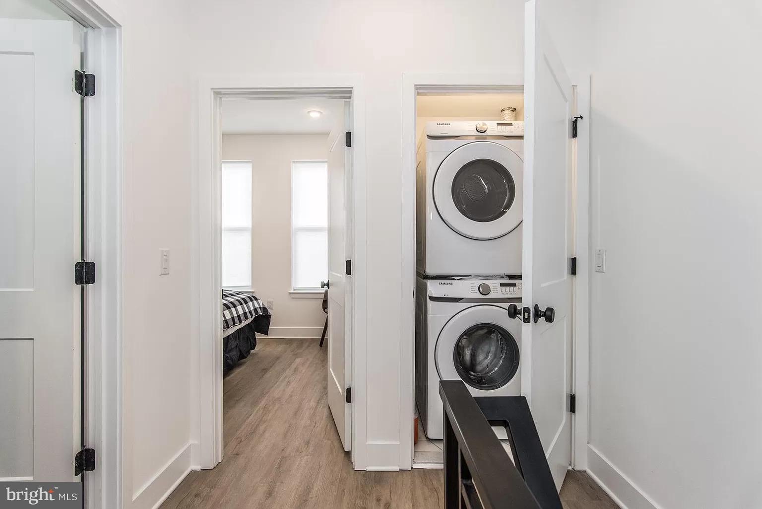2435 Master Street, Unit 2 Philadelphia, PA 19121 - Photo 4 of 9 a view of a hallway with washer and dryer