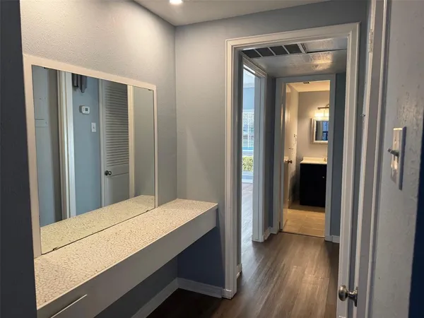 a view of a bathroom from a hallway