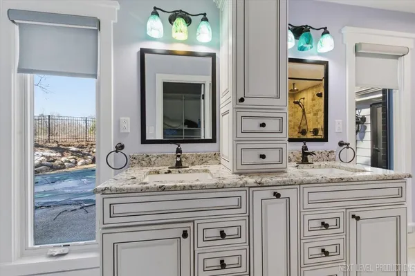 a bathroom with a glass shower door