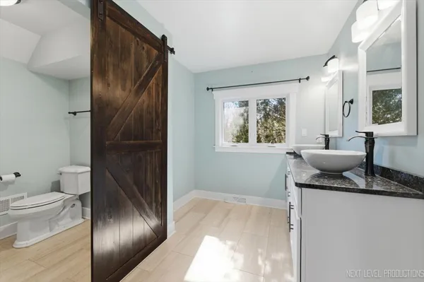 a bathroom with a bathtub and toilet