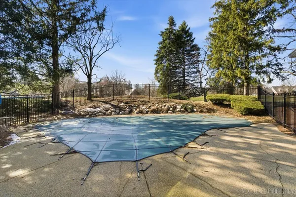 a view of a house with a snow in the yard