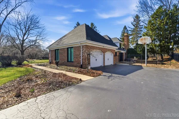 a view of a house with a yard and sitting area