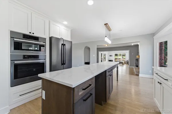 a kitchen with stainless steel appliances a refrigerator and a stove