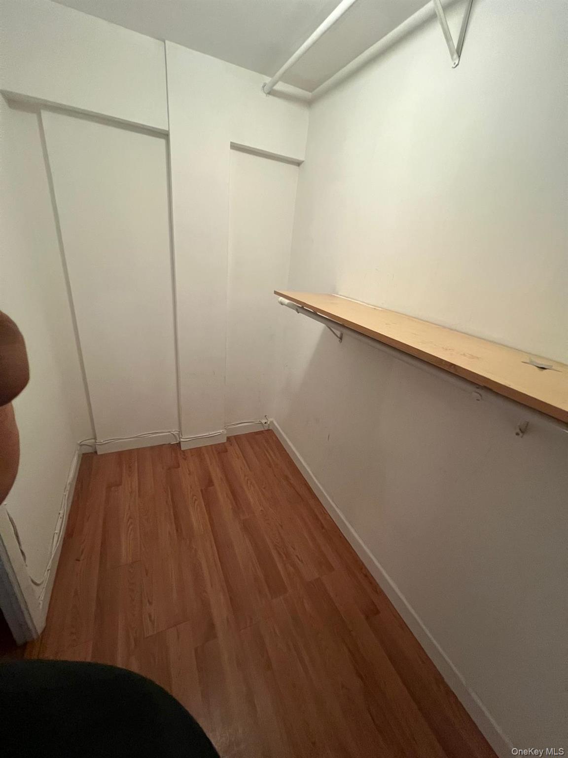 8305 98th Street, Unit 3C Queens, NY 11421 - Photo 10 of 19 a view of small space with racks on the wall