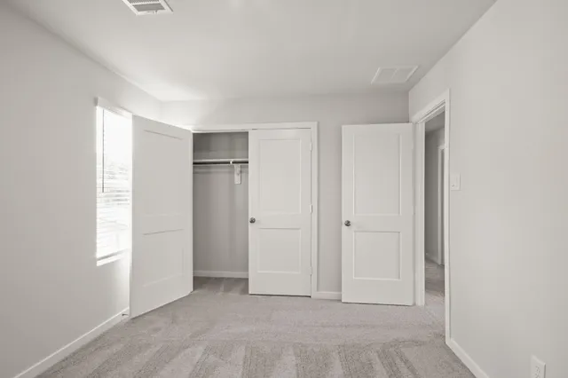 a view of an empty room and window