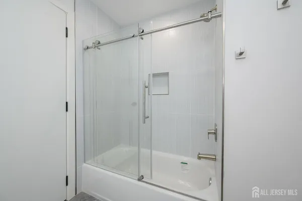 a bathroom with a toilet sink and shower