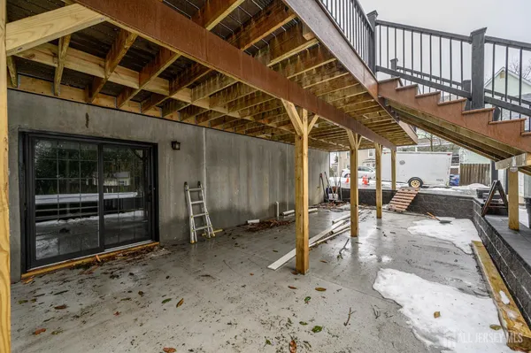 a view of house with backyard space and balcony