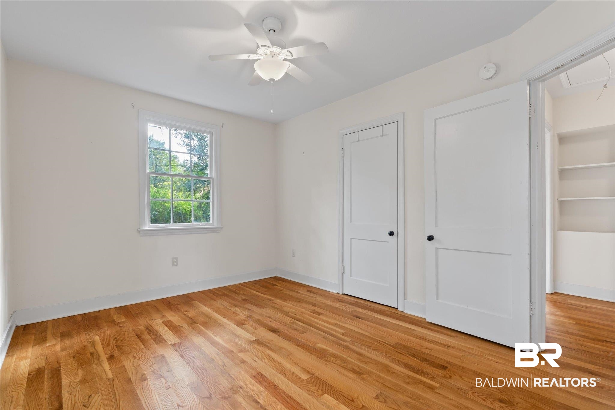 5113 Norton Lane Mobile, AL 36608 - Photo 10 of 20 Unfurnished bedroom with ceiling fan and light hardwood / wood-style flooring