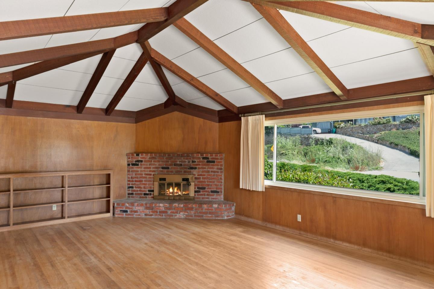 3240 Rio Road Carmel, CA 93923 - Photo 5 of 37 a view of a room with wooden floor and iron stairs