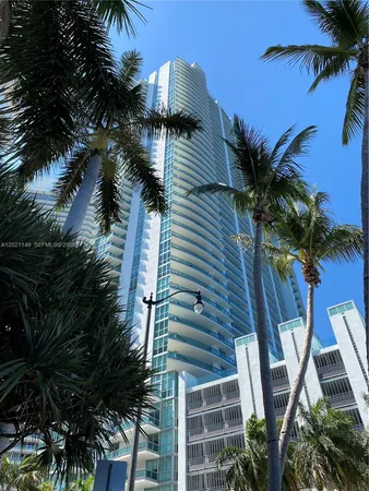 a view of balcony with potted plants and palm trees