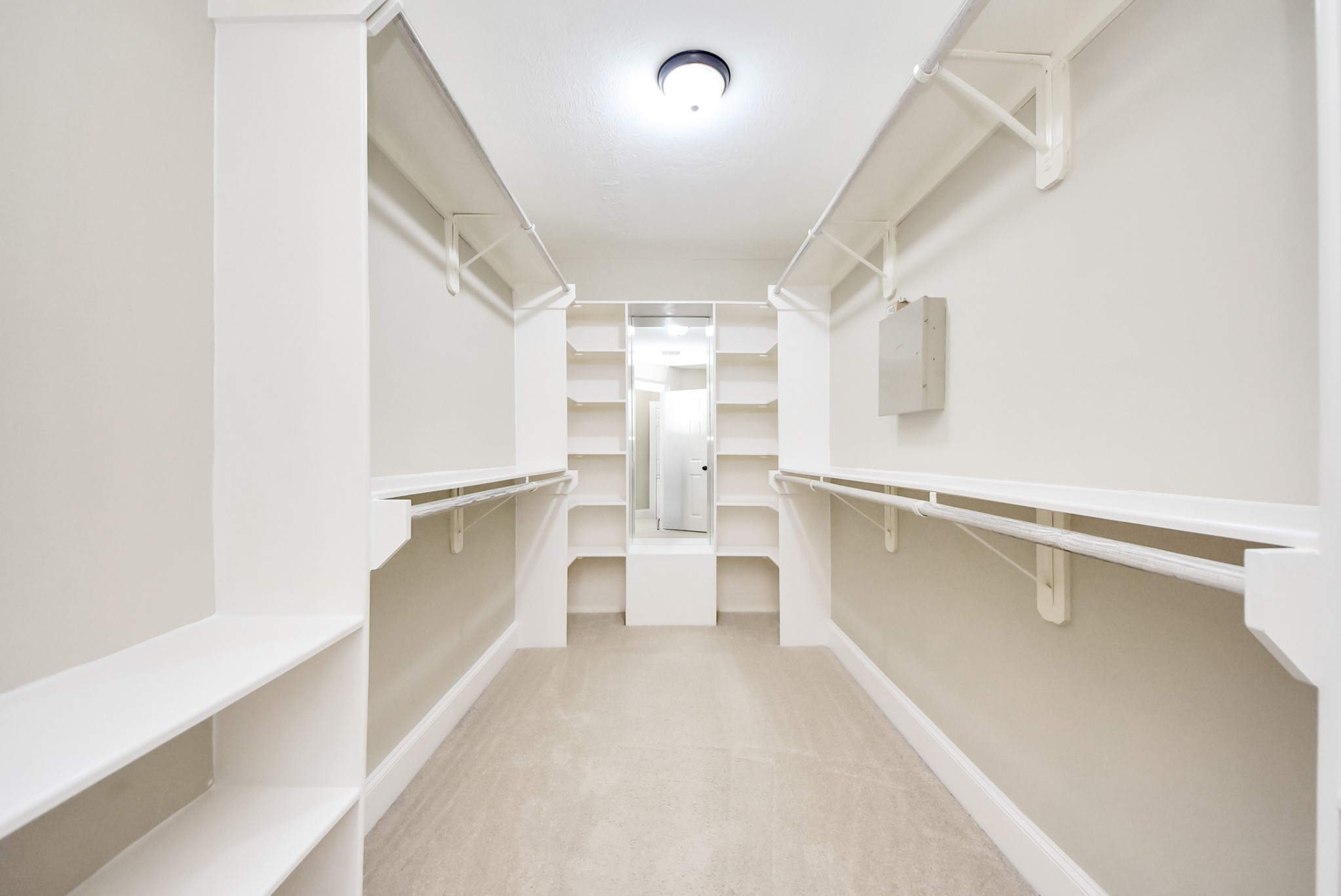 2119 Stuart Street Houston, TX 77004 - Photo 26 of 37 The 15'3"x5'8" primary closet offers wonderful built-ins!