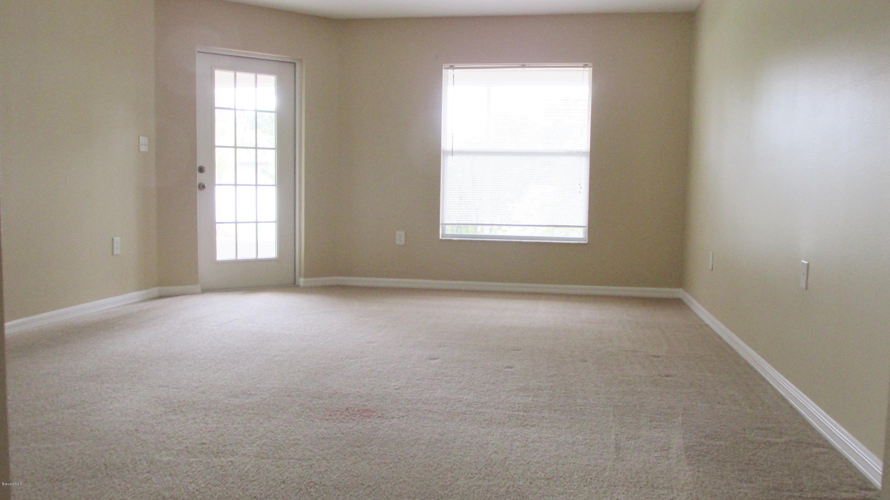 174 Tudor Road Southwest Palm Bay, FL 32908 - Photo 13 of 20 an empty room with a window