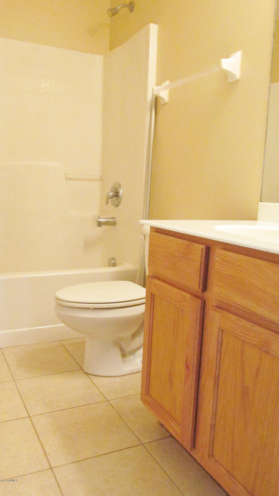 174 Tudor Road Southwest Palm Bay, FL 32908 - Photo 17 of 20 a bathroom with a toilet and a shower