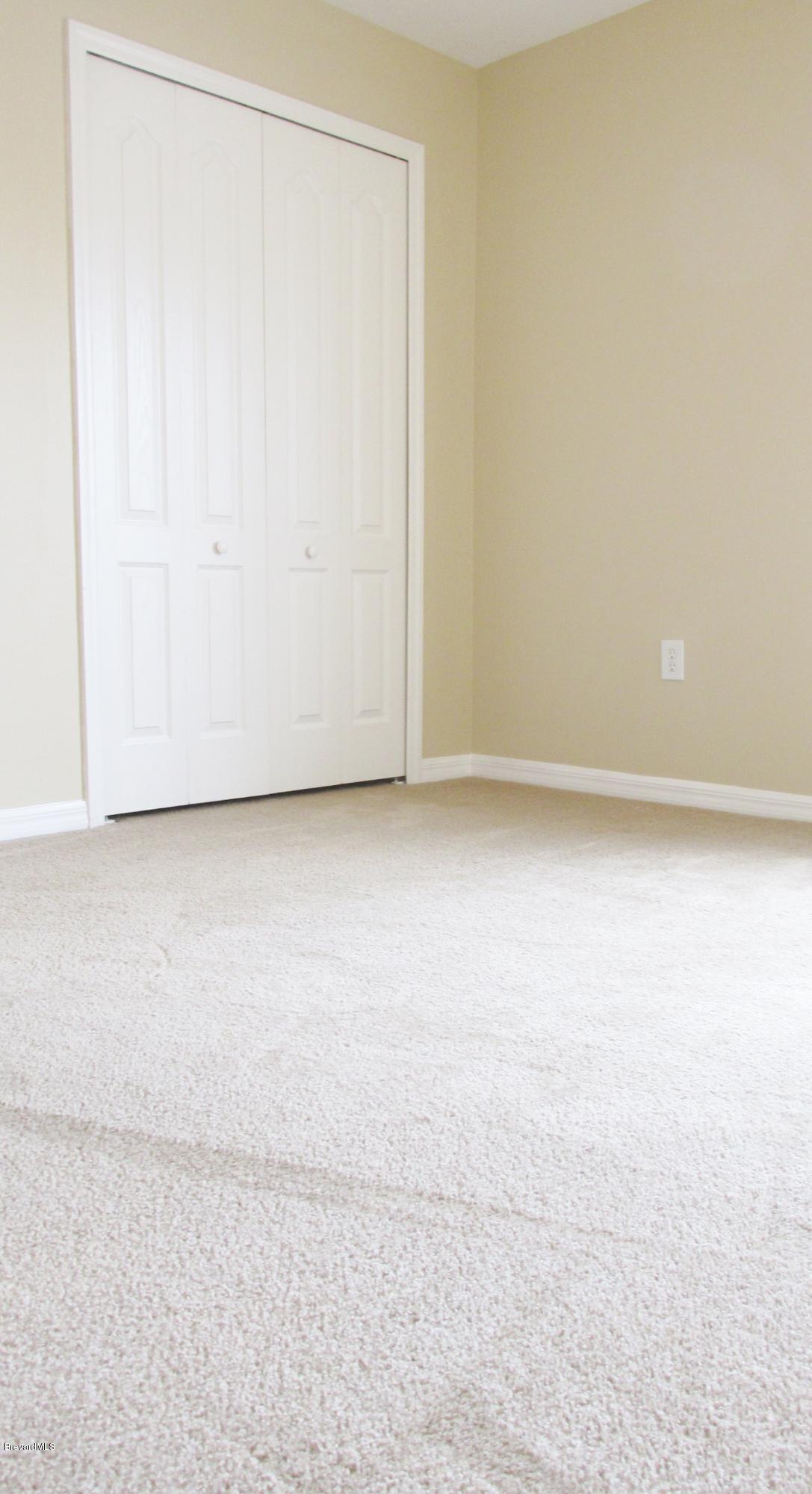 174 Tudor Road Southwest Palm Bay, FL 32908 - Photo 18 of 20 an empty room with a workbench