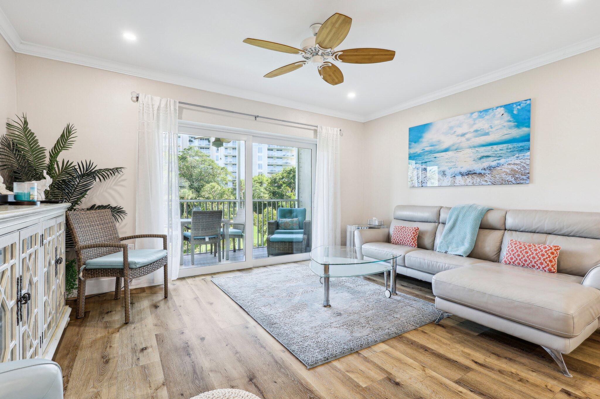 200 East Royal Palm Road, Unit 304 Boca Raton, FL 33432 - Photo 18 of 37 a living room with furniture and a large window
