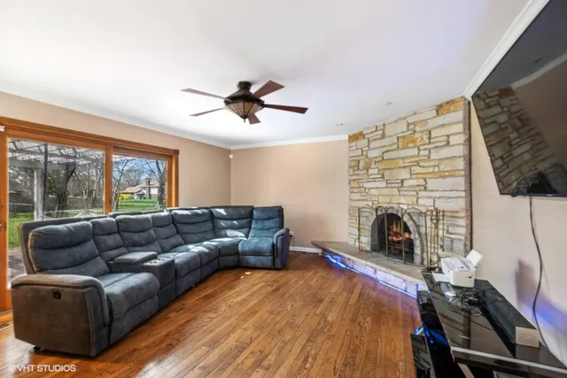 a living room with furniture and a fireplace