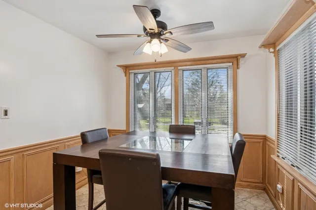 a view of a dining room with furniture window and outside view