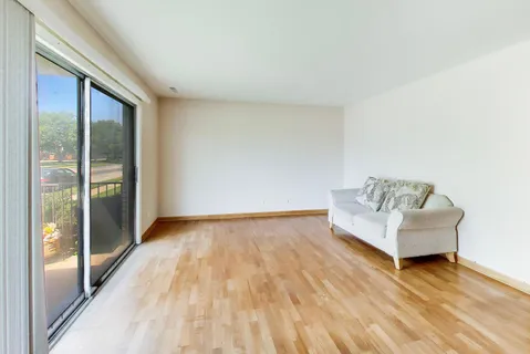 a view of an empty room and wooden floor