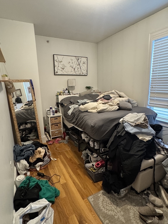 28 Howell Street, Unit 3 Boston, MA 02125 - Photo 6 of 11 a bed sitting in a room next to a window
