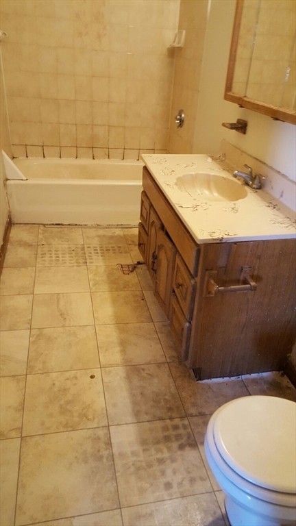 20 Sprague Street West Springfield, MA 01089 - Photo 8 of 12 a bathroom with a granite countertop sink and a mirror