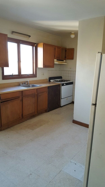20 Sprague Street West Springfield, MA 01089 - Photo 10 of 12 a large kitchen with a large window