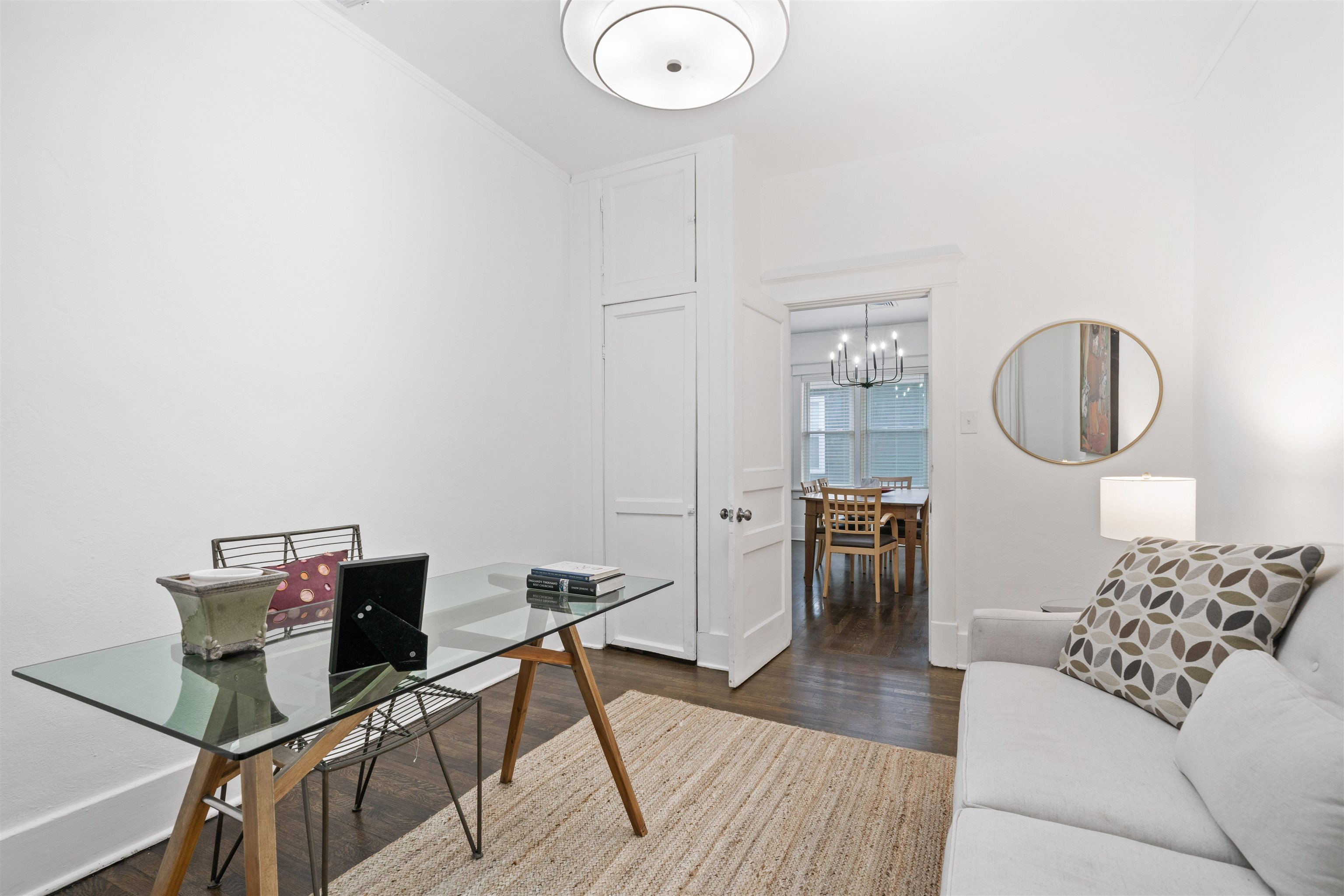 1701 Autumn, Unit 2 Memphis, TN 38112 - Photo 13 of 16 a living room with furniture a mirror and a wooden floor