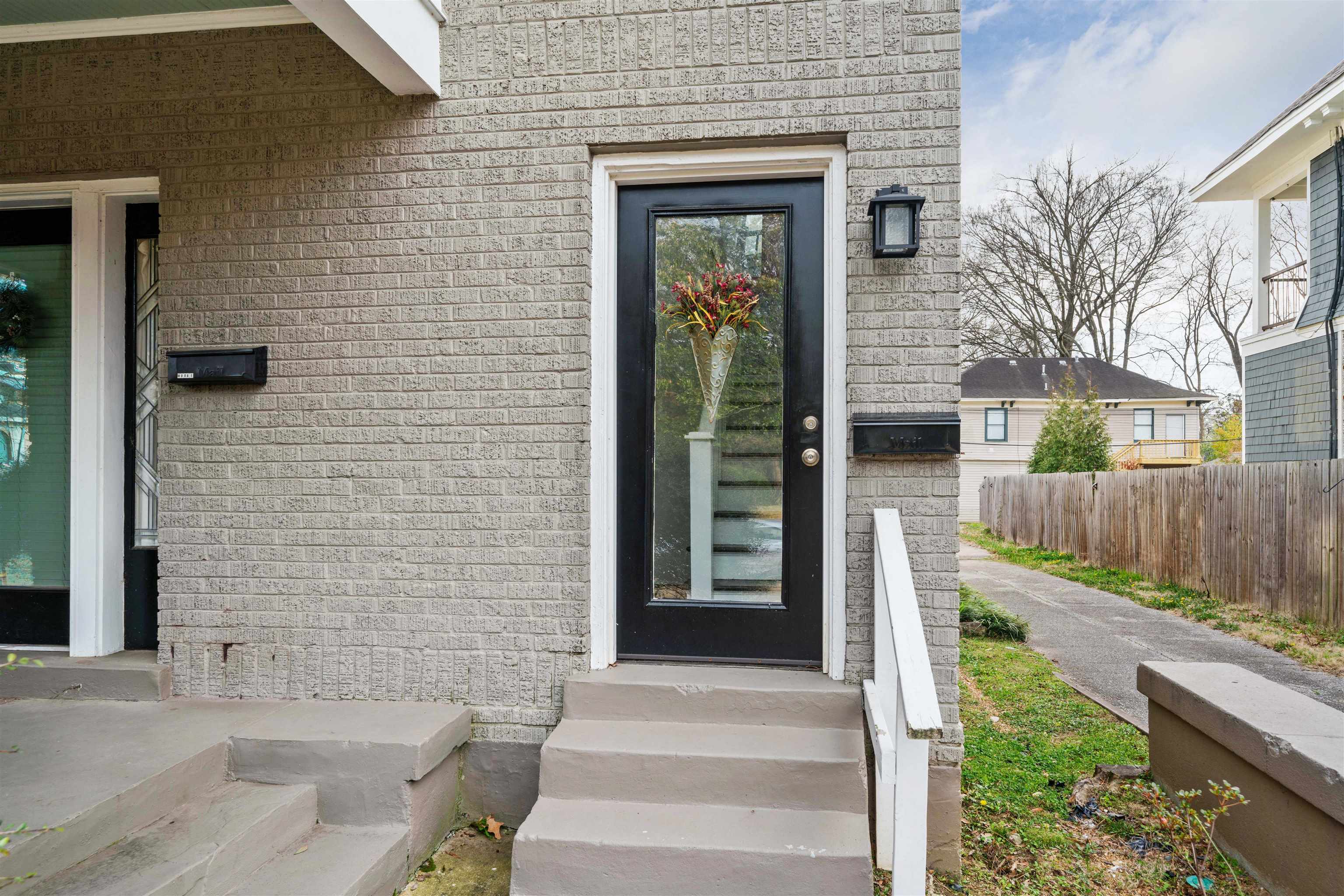 1701 Autumn, Unit 2 Memphis, TN 38112 - Photo 2 of 16 a front view of a house with a garden