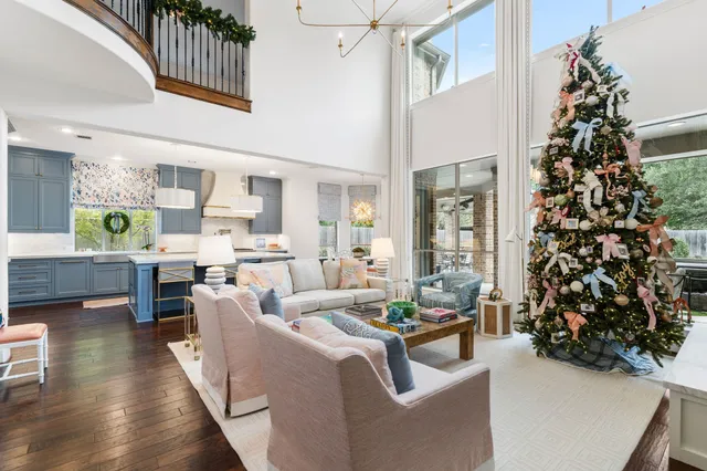 a living room with furniture a window and gym equipment
