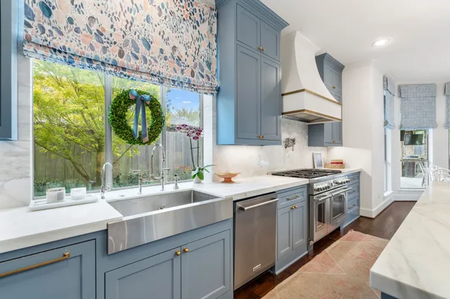 an aerial view of residential houses with outdoor space and river