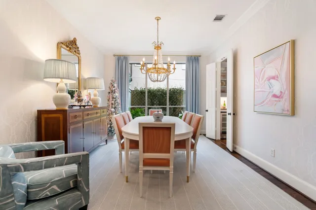 a bedroom with a bed and a lamp on the dresser