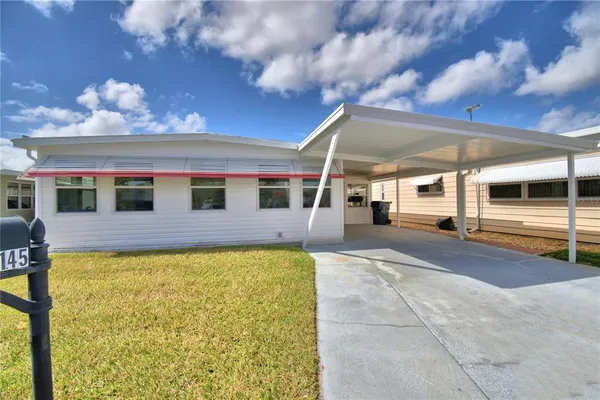 a view of a back yard with a tv