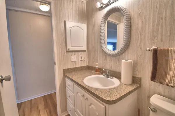 a bathroom with a sink and a mirror