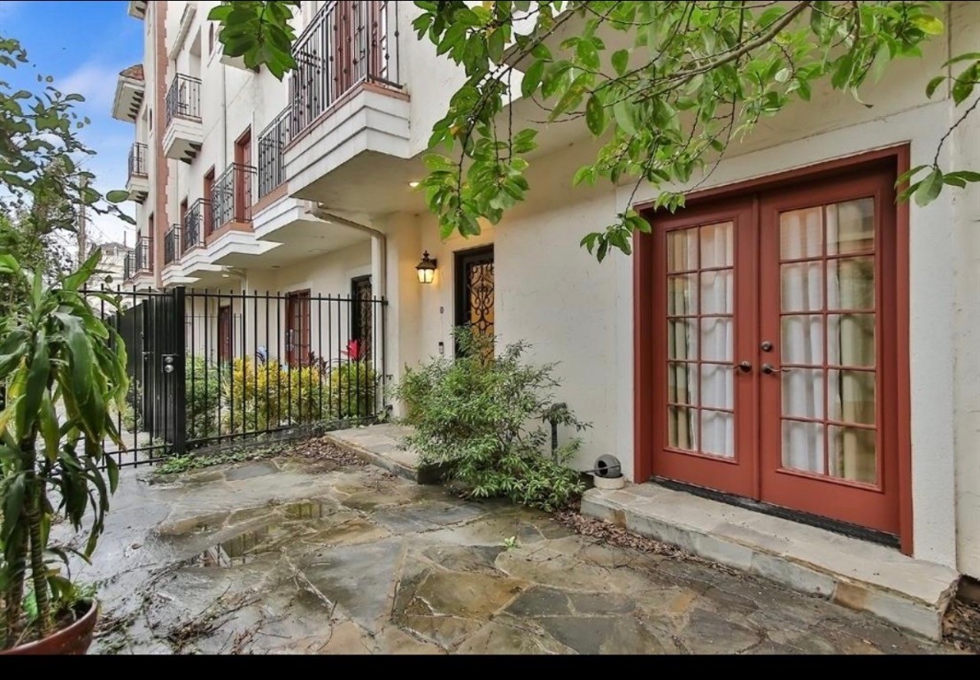 a view of a large brick building next to a yard