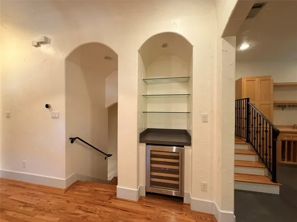 a view of room with wooden floor and closet