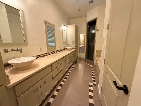 a bathroom with sink and mirror