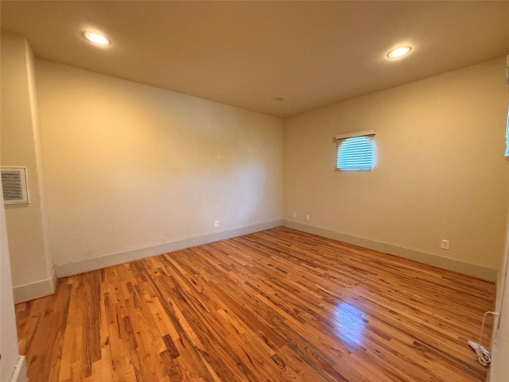 4606 Austin Street, Unit D Houston, TX 77004 - Photo 20 of 25 a view of empty room with wooden floor