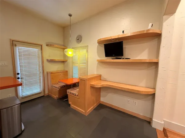 a room with furniture and flat screen tv