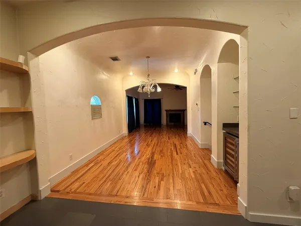 a view of a living room with a wooden floor