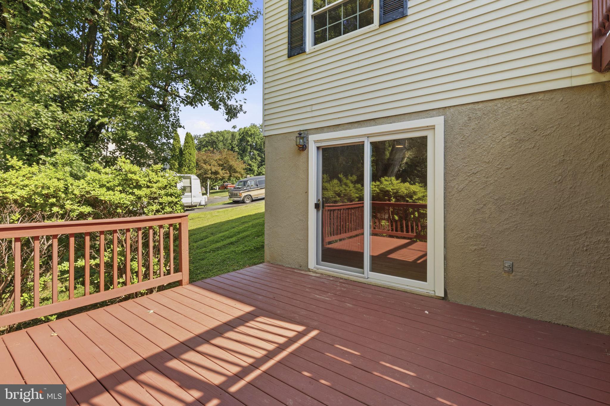 3906 Boxwood Road Jarrettsville, MD 21084 - Photo 35 of 36 Sunny deck with lush greenery view.