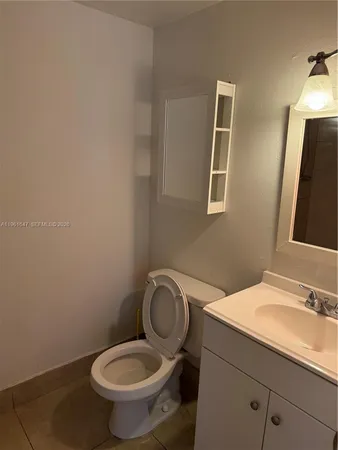 an empty room with a bench