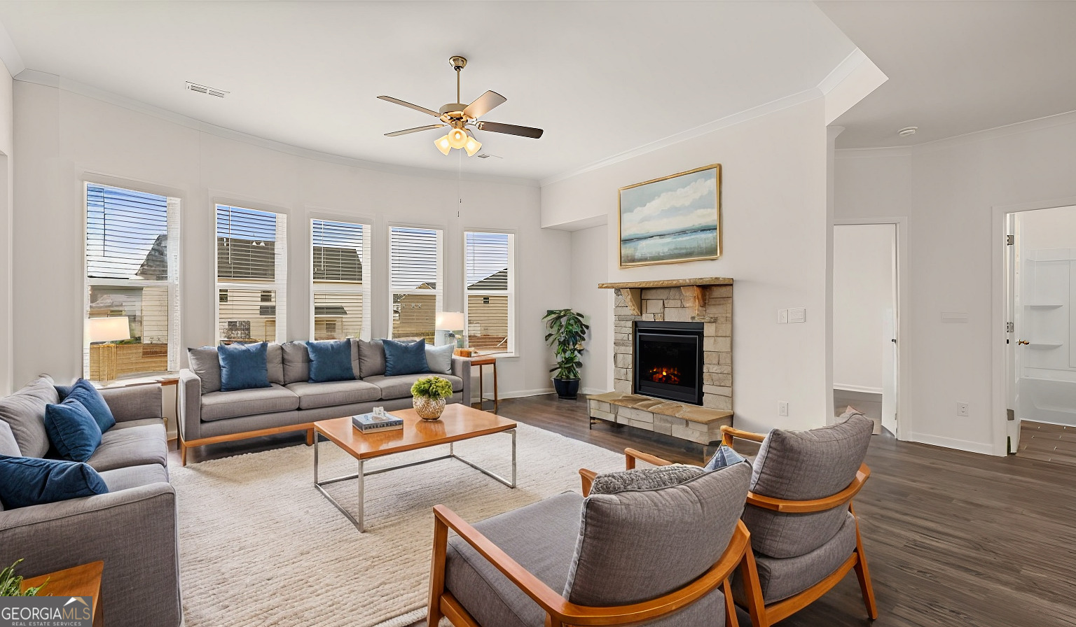 1776 Goodwin Drive Hampton, GA 30228 - Photo 58 of 59 a living room with furniture and a fireplace