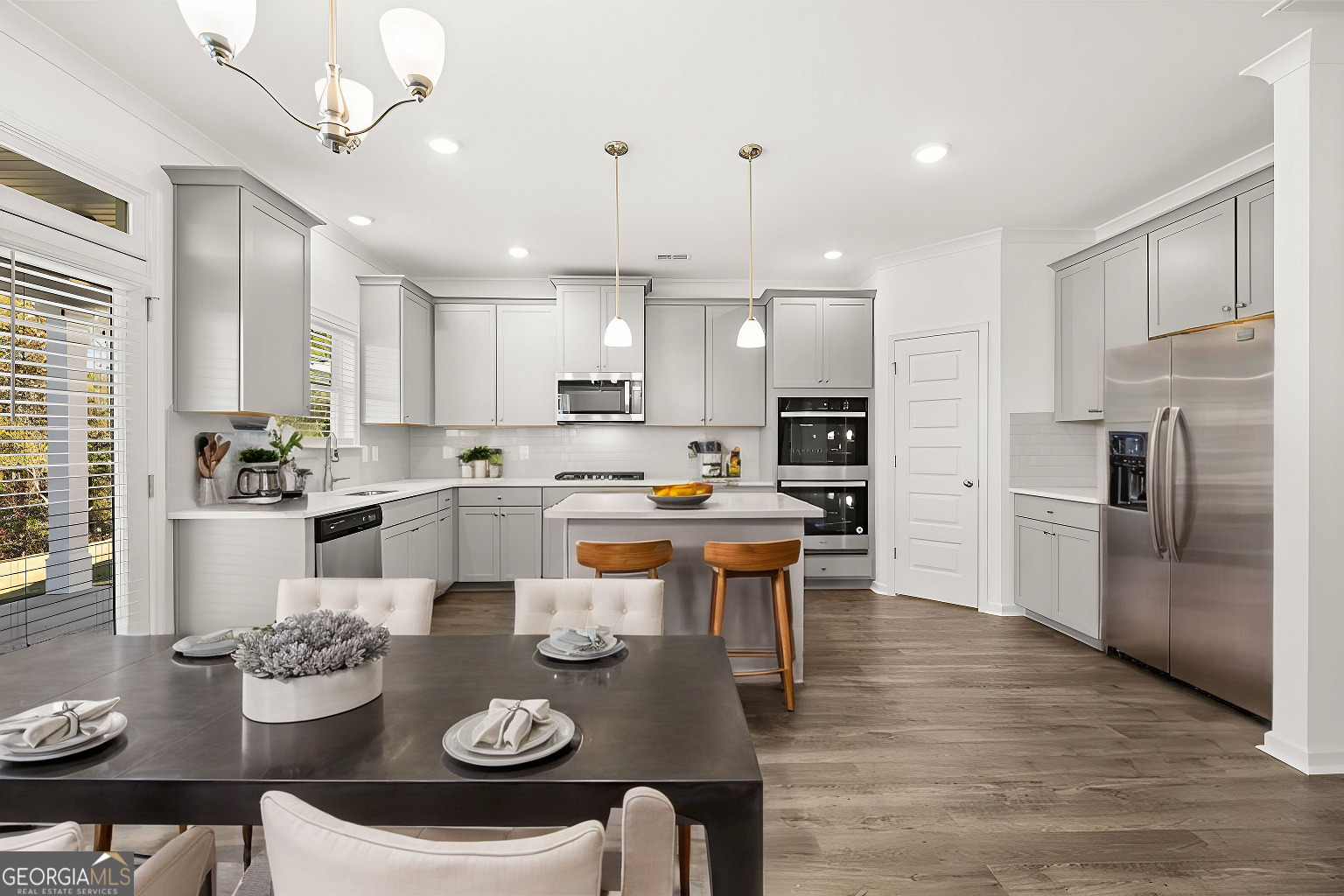1776 Goodwin Drive Hampton, GA 30228 - Photo 8 of 59 a kitchen with stainless steel appliances granite countertop a kitchen island hardwood floor and a sink