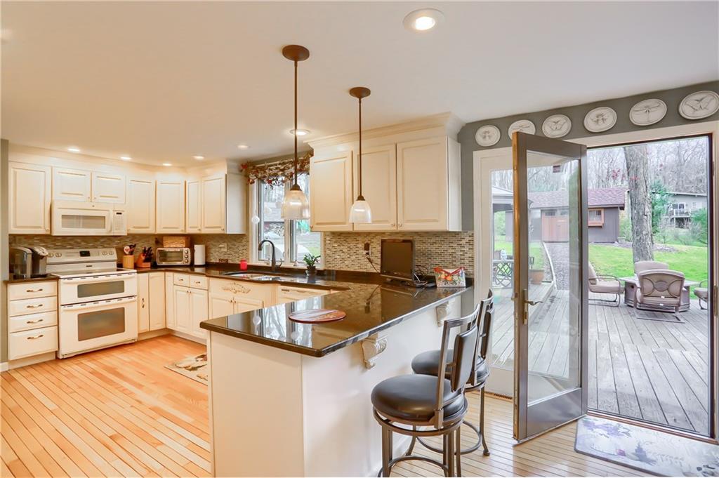 178 Mary Reed Road Baden, PA 15005 - Photo 6 of 25 Eat in kitchen with granite countertops and breakfast bar and French doors leading to your rear deck